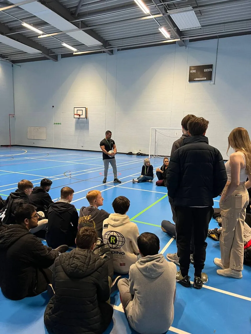 David in session with a sitting group of students