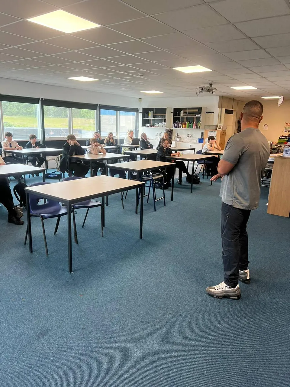 David addressing students at a school session