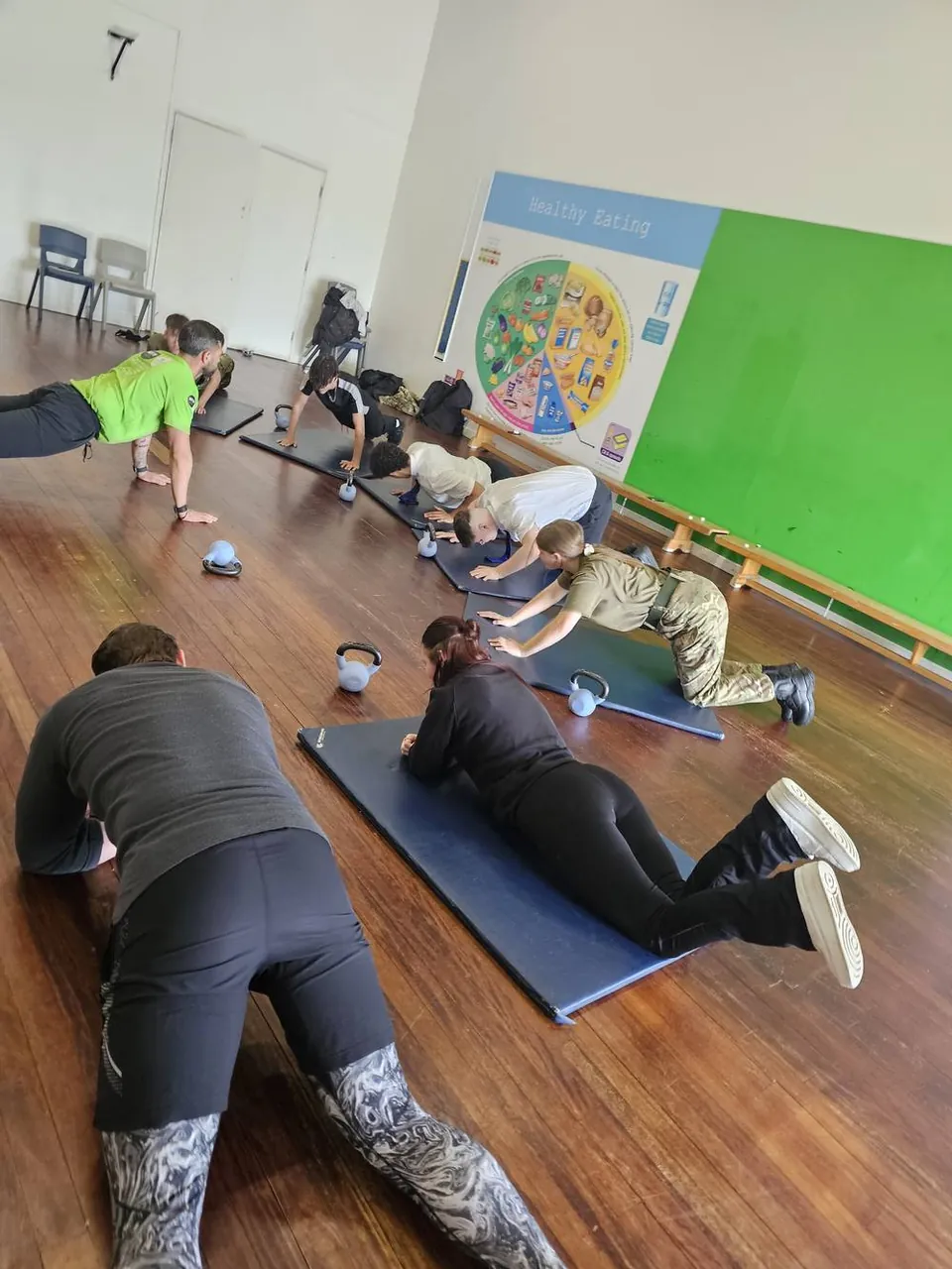 Group fitness session with kettlebells